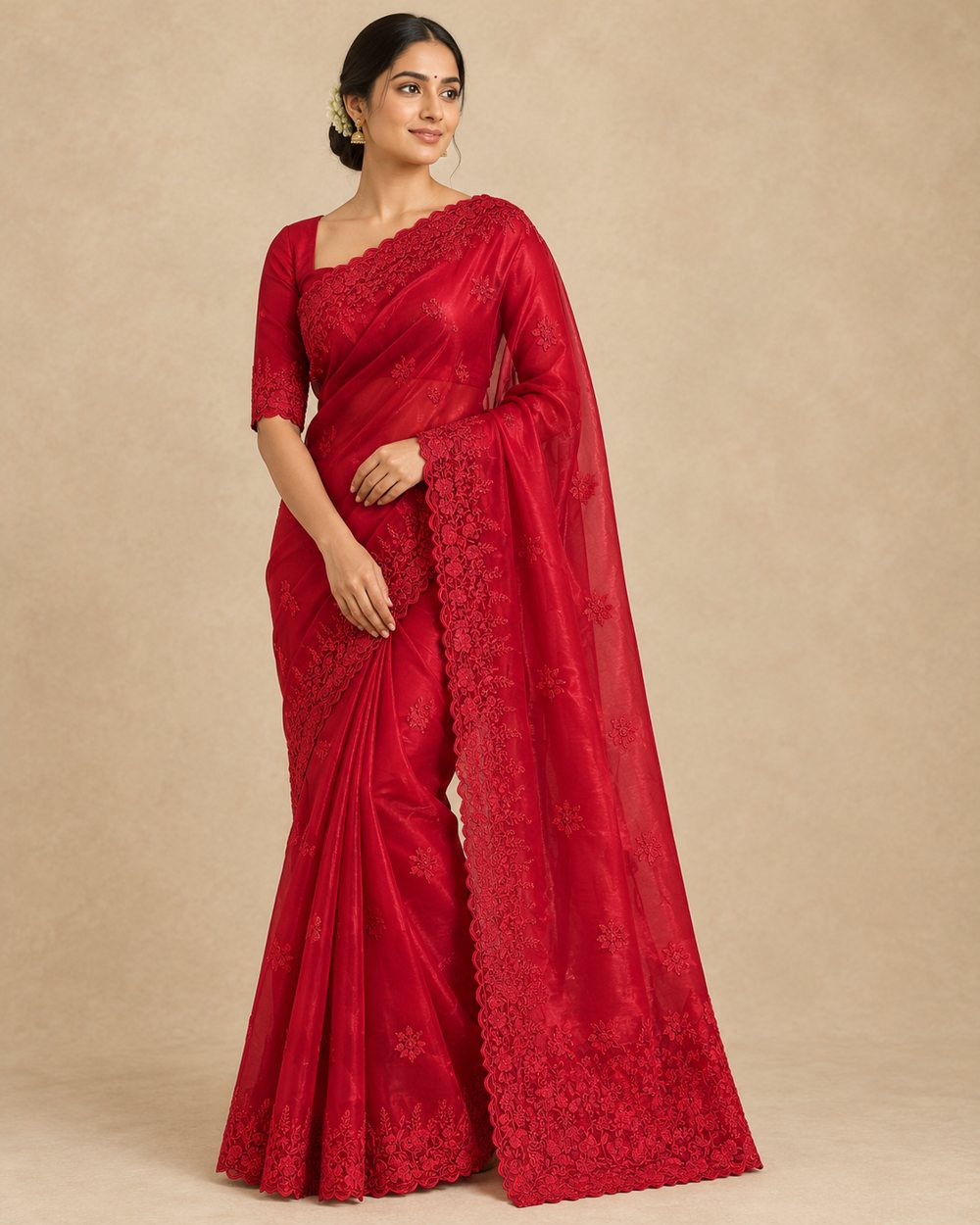 Model wearing a red Sabrang saree with tone-on-tone floral embroidery and a scalloped border